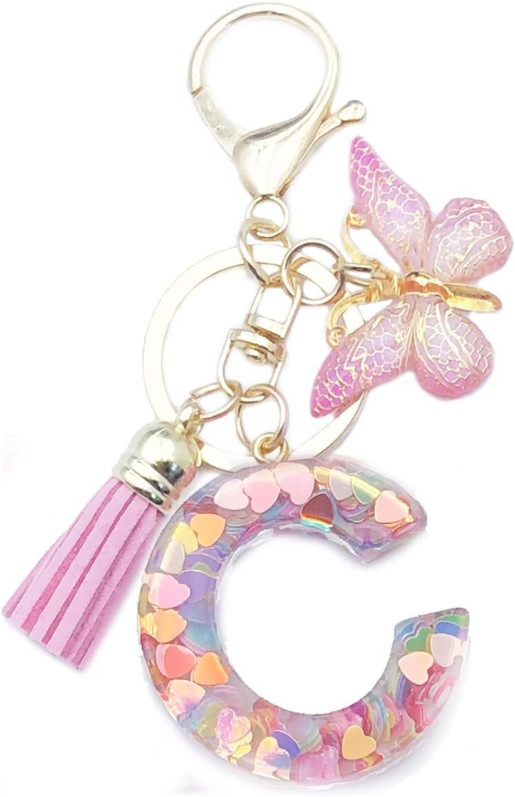 Keychain with letter 'C' charm, tassel, and butterfly